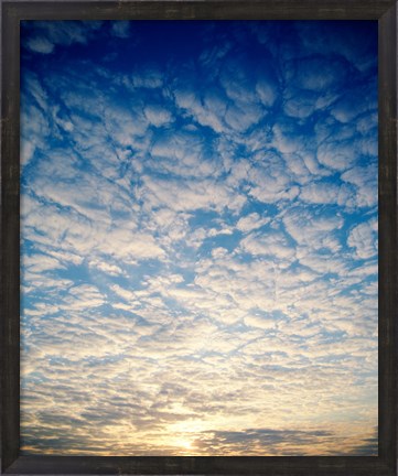 Framed Low angle view of sunrise seen through clouds Print