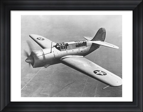 Framed High angle view of a fighter plane in flight, Curtiss SB2C Helldiver, December 1941 Print