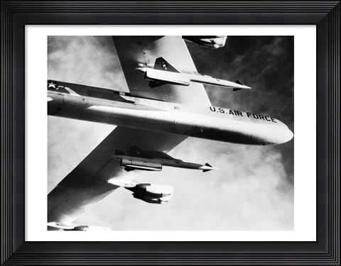 Framed Low angle view of a bomber plane carrying missiles during fight, AGM-28 Hound Dog, B-52 Stratofortress Print