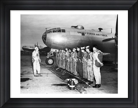 Framed Group of army soldiers standing in a row near a fighter plane, B-29 Superfortress Print