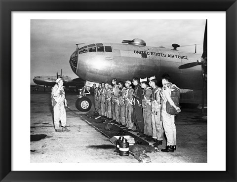 Framed Group of army soldiers standing in a row near a fighter plane, B-29 Superfortress Print