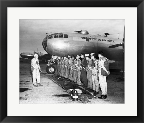 Framed Group of army soldiers standing in a row near a fighter plane, B-29 Superfortress Print