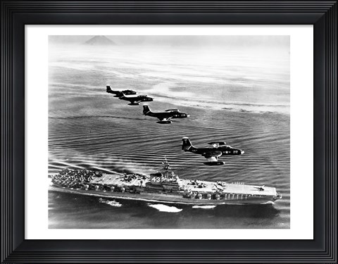 Framed High angle view of four fighter planes flying over an aircraft carrier, US Navy Banshees, USS Coral Sea (CV-43) Print