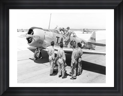 Framed Rear view of four soldiers standing near a fighter plane, T-6 Texan Print