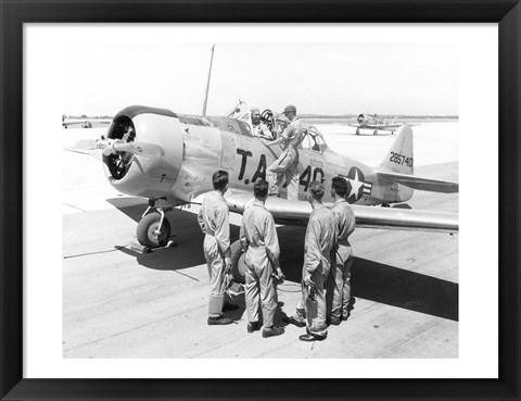 Framed Rear view of four soldiers standing near a fighter plane, T-6 Texan Print