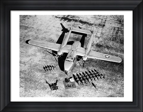 Framed High angle view of soldiers standing near a military airplane, Fairchild C-119 Flying Boxcar Print