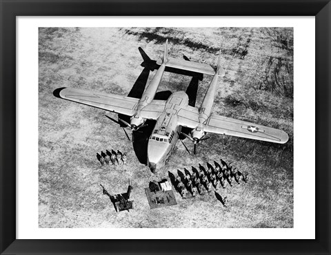 Framed High angle view of soldiers standing near a military airplane, Fairchild C-119 Flying Boxcar Print