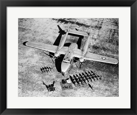 Framed High angle view of soldiers standing near a military airplane, Fairchild C-119 Flying Boxcar Print