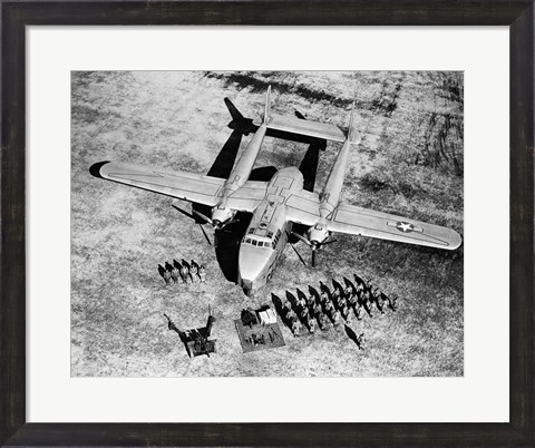 Framed High angle view of soldiers standing near a military airplane, Fairchild C-119 Flying Boxcar Print