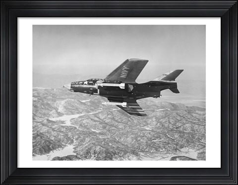 Framed Side profile of a fighter plane carrying sidewinder missiles during flight, F9F-8 Cougar, US Navy Print
