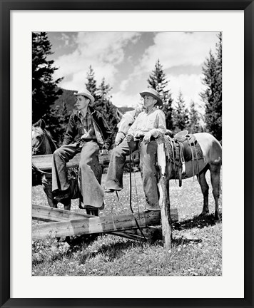 Framed Teenage cowboys sitting on rail fence Print