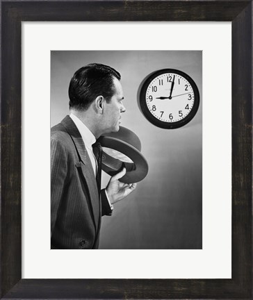 Framed Businessman looking at clock Print