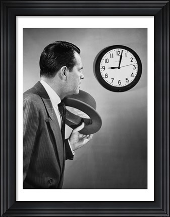 Framed Businessman looking at clock Print