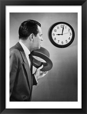 Framed Businessman looking at clock Print