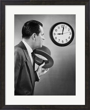 Framed Businessman looking at clock Print