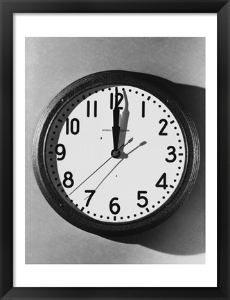 Framed Close-up of a wall clock hanging on a wall Print