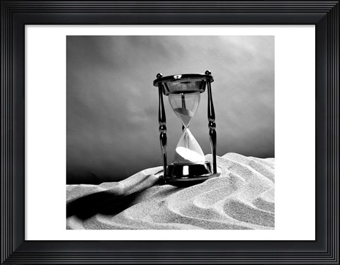 Framed Close up of hourglass on sand Print