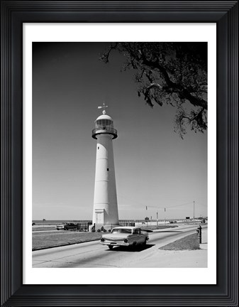 Framed USA, Mississippi, Biloxi, Biloxi Lighthouse with street in the foreground Print