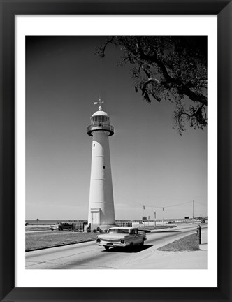 Framed USA, Mississippi, Biloxi, Biloxi Lighthouse with street in the foreground Print