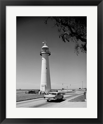 Framed USA, Mississippi, Biloxi, Biloxi Lighthouse with street in the foreground Print