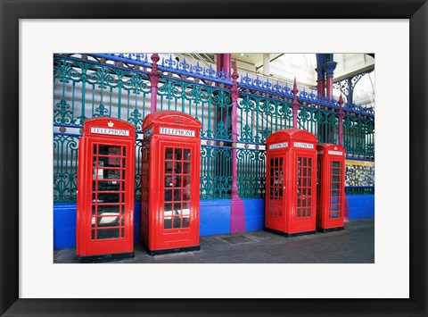 Framed Four telephone booths near a grille, London, England Print