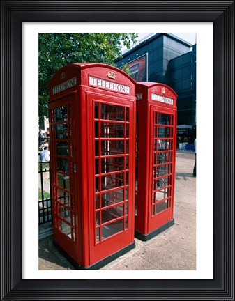 Framed Two telephone booths, London, England Print