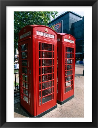 Framed Two telephone booths, London, England Print