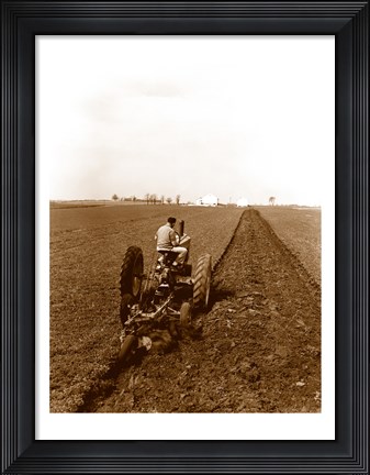 Framed USA, Pennsylvania, Farmer on Tractor Plowing Field Print