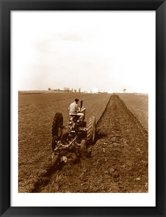 Framed USA, Pennsylvania, Farmer on Tractor Plowing Field Print