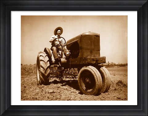 Framed Farmer Plowing a Field with a Tractor Print