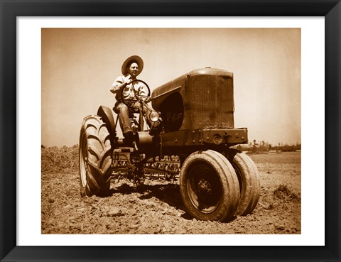 Framed Farmer Plowing a Field with a Tractor Print