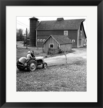 Framed Man with a Boy Riding a Tractor in a Field Print