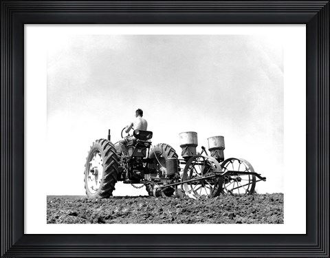 Framed Low Angle View of a Farmer Planting Corn with a Tractor in a Field Print