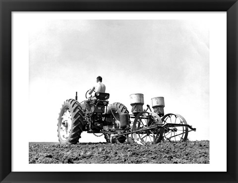 Framed Low Angle View of a Farmer Planting Corn with a Tractor in a Field Print