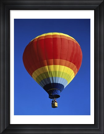 Framed Low angle view of a hot air balloon rising, Albuquerque International Balloon Fiesta, Albuquerque, New Mexico, USA Print