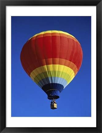 Framed Low angle view of a hot air balloon rising, Albuquerque International Balloon Fiesta, Albuquerque, New Mexico, USA Print