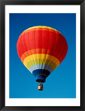 Framed Low angle view of a hot air balloon in the sky, New Mexico, Rainbow Print