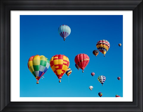 Framed Low angle view of a group of hot air balloons in the sky Print