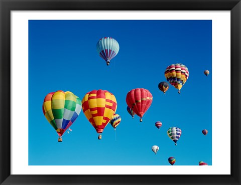 Framed Low angle view of a group of hot air balloons in the sky Print