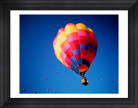 Framed Lone Hot Air Balloon with Other Hot Air Balloons in the Distance Print