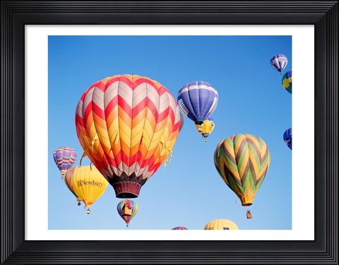 Framed Low angle view of hot air balloons in the sky Print