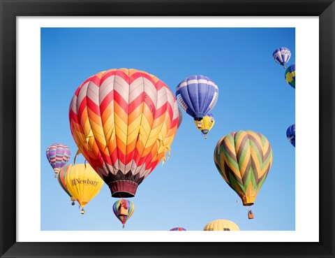 Framed Low angle view of hot air balloons in the sky Print