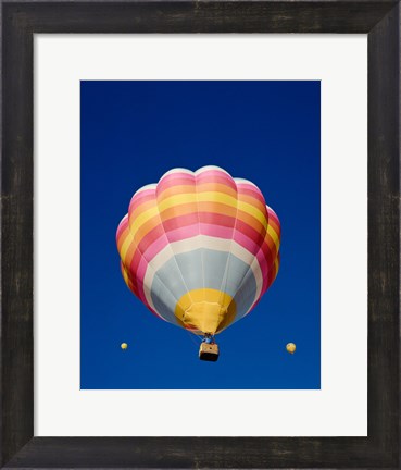 Framed Low Angle Shot of a Rainbow Hot Air Balloon Print