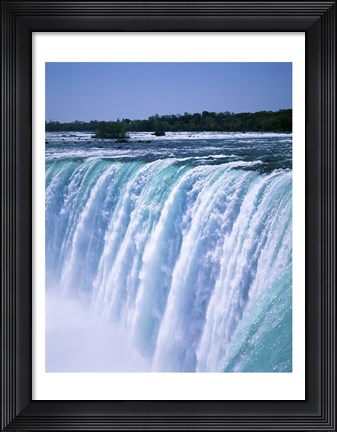 Framed Water flowing over Niagara Falls, Ontario, Canada Print