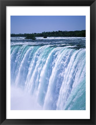 Framed Water flowing over Niagara Falls, Ontario, Canada Print