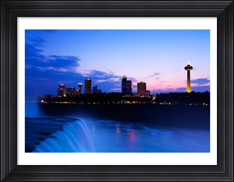 Framed Waterfall with buildings lit up at dusk, American Falls, Niagara Falls, City of Niagara Falls, New York State, USA Print