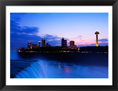 Framed Waterfall with buildings lit up at dusk, American Falls, Niagara Falls, City of Niagara Falls, New York State, USA Print