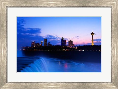 Framed Waterfall with buildings lit up at dusk, American Falls, Niagara Falls, City of Niagara Falls, New York State, USA Print