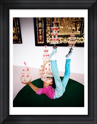 Framed Acrobat balancing glasses, Shanghai, China Print