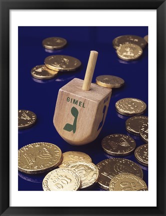 Framed Close-up of a Hanukkah dreidel with Hanukkah gelts Print